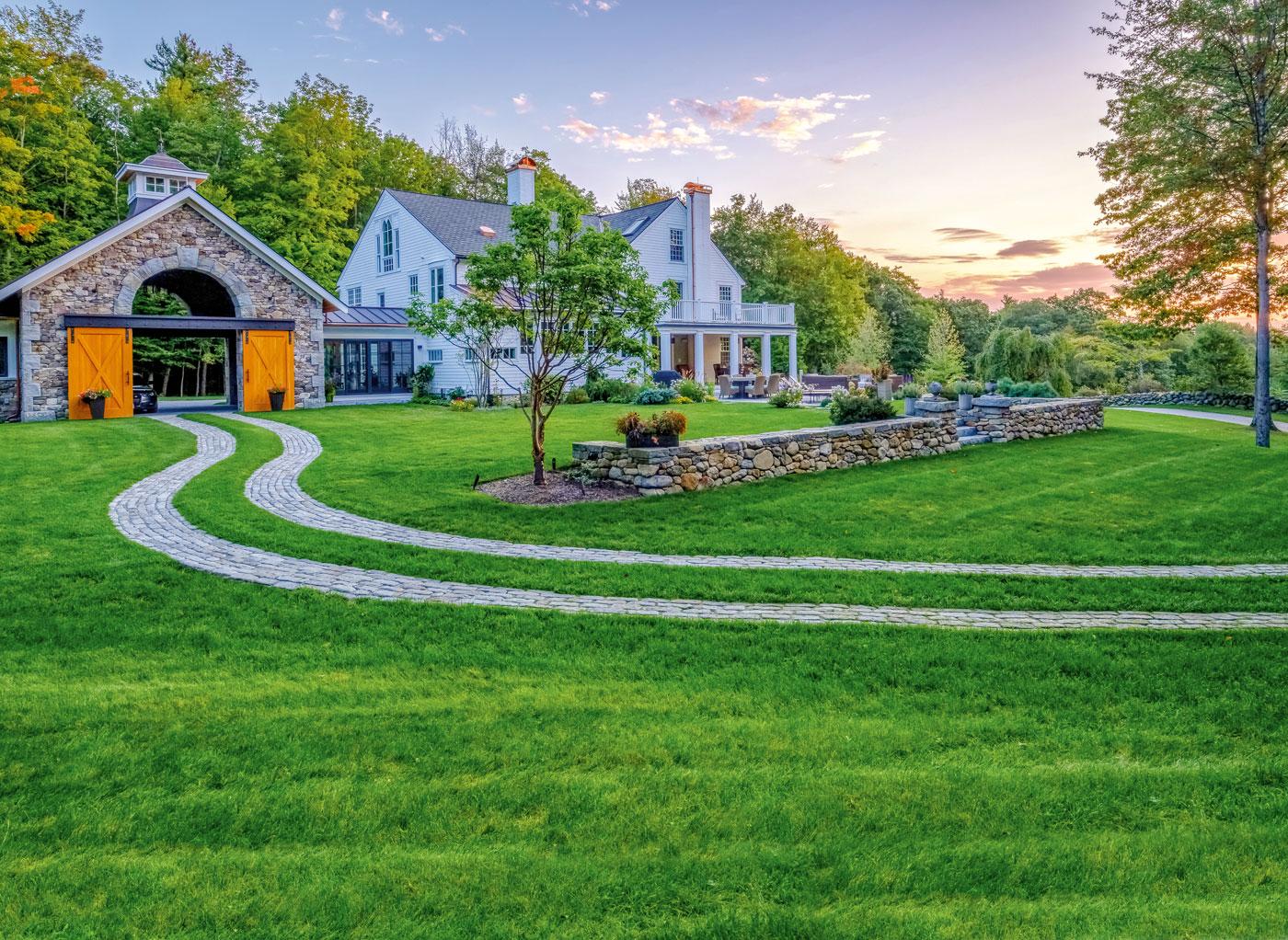 High-end landscape design and driveway by Pellettieri Associates, Inc.